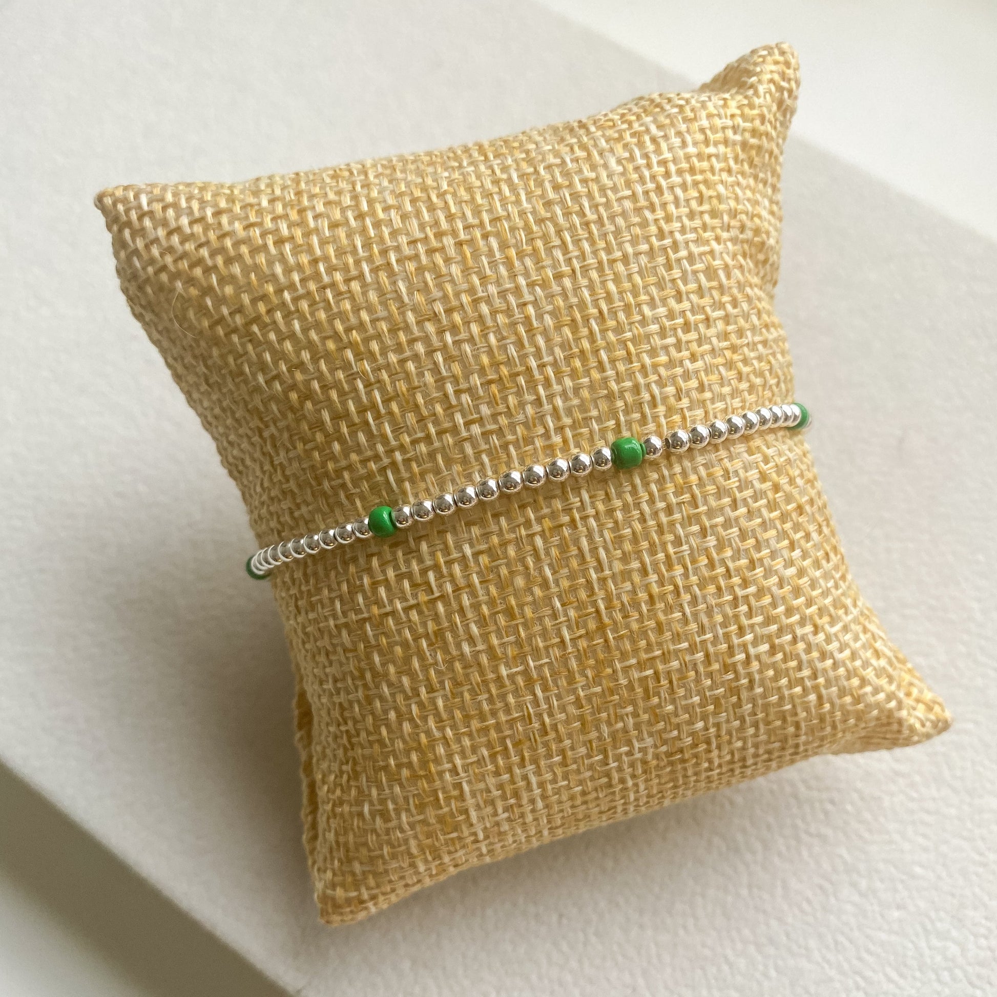 Green and silver beaded bracelet